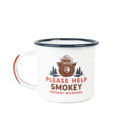 a white and blue enamel camping mug with the words please help smokey on it