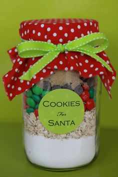 a jar with cookies in it and a green label on the top that says cookies for santa