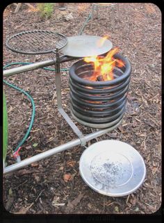 a metal bowl sitting on top of a fire pit