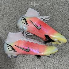 a pair of nike soccer cleats on the ground