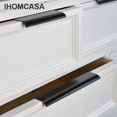 the drawer handles are black and white in color