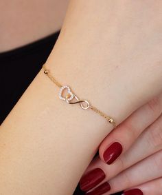 14K Gold Heart and Infinity Symbol Bracelet A symbol of infinite love, this elegant bangle bracelet showcases the symbols of love and eternity entwined with each other. The heart motif perfectly complements the infinity symbol for a truly romantic look. This unique bracelet is perfect for everyday wear as it is made of solid gold and won't tarnish. It is a wonderful gift for a special person. Features: * This bracelet is made of patented 14K solid gold. * It has a 16cm chain and 2cm charm with t Gold Unique Bracelet For Women, Heart And Infinity Necklace, Hand Wear Accessories, Fashion And Accessories, Women’s Bracelets Gold, Beautiful Bracelet Gold, Bracelet Ideas Gold Women, A Bracelet Gold, Fancy Bracelets Gold