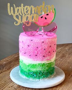 a watermelon slice cake with sunglasses on top