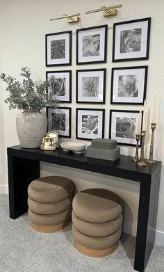 a black table topped with pictures and stools