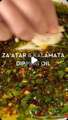 someone is adding ingredients to a dish in a bowl with the words zaatar and kalamata dipping oil