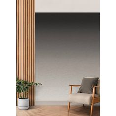 a chair sitting in front of a tall wooden wall next to a potted plant