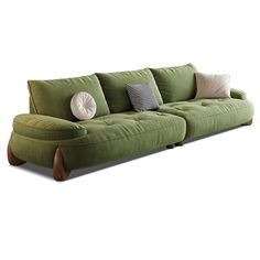 a green couch with four pillows on it