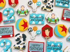 decorated cookies are arranged in the shape of planes and numbers, with characters on them