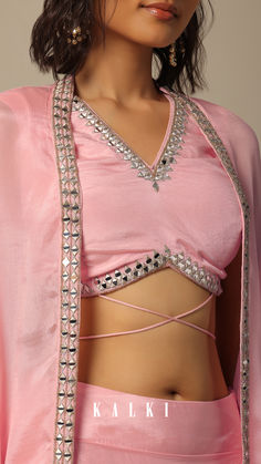 Showcase your stunning style by stepping out in this indo-fusion set. Crafted in chiffon, it is decked in a stunning pink hue. Adorned with mirror and beads, the sleeveless blouse comes with a V neckline. Paired with a jacket and dhoti, this three-piece attire is ideal for festivals and weddings. Pink Bollywood Blouse With Traditional Drape, Pink Pre-draped Saree With Dori Work For Festivals, Pink Pre-draped Saree With Unstitched Blouse For Festivals, Pink Draped Blouse Piece For Diwali, Diwali Embellished Draped Blouse, Backless Blouse Designs, Blouse Neck, Backless Blouse, Designer Blouse Patterns