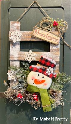 a wooden sign with a snowman hanging from it's side and the words merry christmas on it