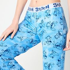 Sleep soundly knowing you are in the comfort of this pair of junior's and women's graphic pajama pants from Disney featuring the lovable alien, Stitch. They are made from soft stretch-jersey with an embroidered elastic waistband for easy on-and-off.# Pieces In Set: 1 PairFeatures: Comfort WaistbandCharacter: StitchClosure Type: Full ElasticApparel Length: 44.25 InchesFiber Content: 95% Polyester, 5% SpandexFabric Description: JerseyInseam: 30 1/2 InCare: Machine Wash, Tumble DryCountry of Origi… Trousers, Disney, Pants Blue, Pants Color, Pajama Pants, Pajamas, Elastic, Pants, Blue