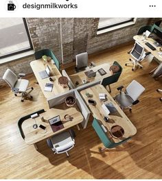 an overhead view of office desks and chairs in a room with wood flooring