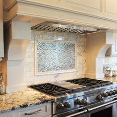 a stove top oven sitting inside of a kitchen next to an oven and countertop