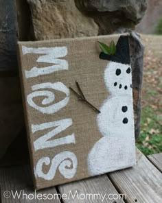 a canvas with a snowman on it