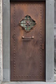 a metal door with a window on it