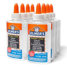 four bottles of cleaner are lined up on a white surface with an orange top and bottom