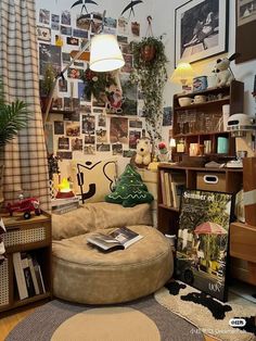 a living room filled with lots of furniture and pictures on the wall next to a window