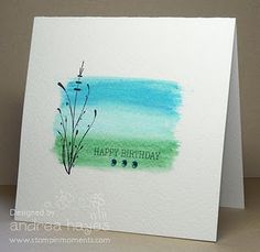 a birthday card with watercolor paint on it