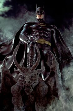 a man dressed as batman standing on top of a bull with his hands in his pockets