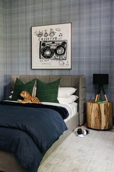 a bedroom with a tiger on the bed