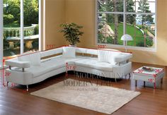 a woman laying on the floor in front of a white sectional sofa and coffee table