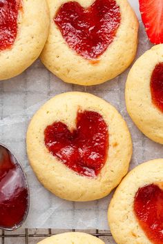 strawberry shortbreads with heart shaped cookies and jam on the side, ready to be eaten