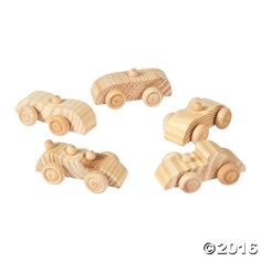 four wooden toy cars sitting on top of each other