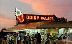 people are standing in line at the dairy palace