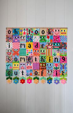 a wall hanging made out of letters and numbers