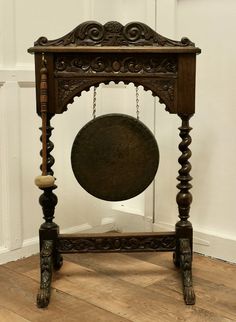 an old wooden table with a pendulum on it