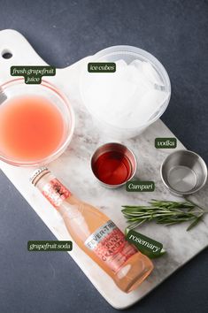 ingredients to make an alcoholic cocktail on a marble tray