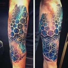 a man's arm with an abstract tattoo design on the left forearm and half sleeve