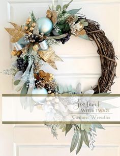 a wreath on the front door with christmas ornaments and greenery hanging from it's sides