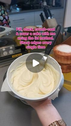 a person is holding a bowl with cake in it and the caption reads, fill stack, crumb - coat & cover a cake with me using the lid instead sharp edges every shape