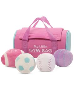 a pink gym bag with three balls and one ball in it, on a white background