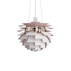 a white and pink light fixture hanging from a ceiling