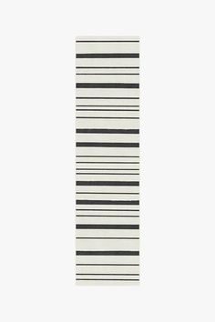 a black and white striped rug on a white background