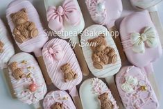 decorated cookies with teddy bears and bows are arranged in rows on top of each other