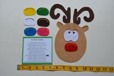 the paper reindeer is next to a ruler