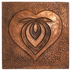 a metal heart with an abstract design on it