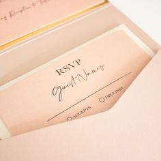 two envelopes with writing on them sitting next to each other