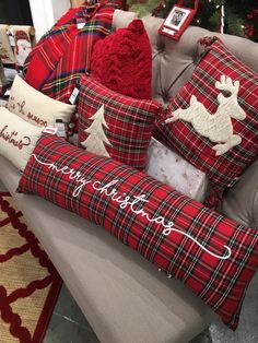 red plaid pillows and christmas decorations on a couch