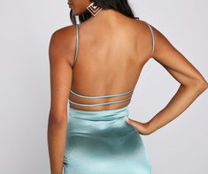 You'll look so dreamy in this sleek satin mini dress. It features a sleeveless square neckline. spaghetti straps. an open back with a lower back dual strap design. front ruching. and a short. curve-hugging silhouette with a wrap-front hem. Style this dress with clear heels.Fit & Features Sleeveless square neckline Spaghetti straps Open back with lower back dual strap design Front ruching Mini-length. form-hugging fit. wrap-front hem Satin fabric. moderate stretch Runs true to size Strappy Back Satin Dress, Satin Strap Mini Dress, Satin Mini Dress With Straps, Strappy Back Satin Dress For Night Out, Elegant Strappy Mini Dress With Lace-up Back, Fitted Slip Dress With Ruched Strappy Back, Fitted Satin Dress With Tie And Strappy Back, Fitted Slip Dress With Ruched And Strappy Back, Strappy Satin Dress With Straps