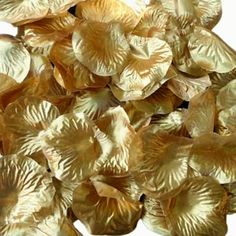 gold foiled flower petals on a white background