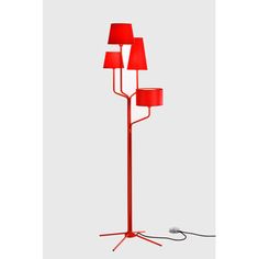 a red floor lamp with three lamps on each side and one light on the other