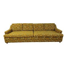 an old fashioned couch with floral fabric on it's arms and back cushions, against a white background