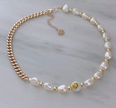 "ITEM DETAILS: * Material: 18k Gold Filled Chain Freshwater Pearl Gold Plated Beads Ceramic Smiley Face Beads Nickel Free Hypoallergenic * Size Chain: 15\" + 2\" Extension Each Necklace is Handmade 💕 If you have any suggestions, just let me know in a message and I will try to do my best according to availability at the time of order. * Shipment: Everything Is made to order. Order preparation may tak 3 To 5 business day. * Packaging: The jewels are packed and delivered in a beautiful packaging, Smiley Face Beads, Smiley Face Necklace, Y2k Necklace, Horoscope Necklace, Face Necklace, Gold Filled Necklace, Gift For Best Friend, Gold Cross Necklace, Initial Necklace Gold