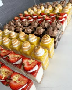 a table topped with lots of different types of desserts