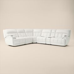 a white leather sectional sofa with recliners on the back and armrests