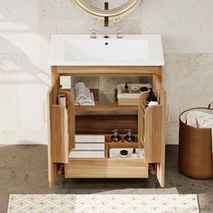 a bathroom with a sink and wooden cabinet